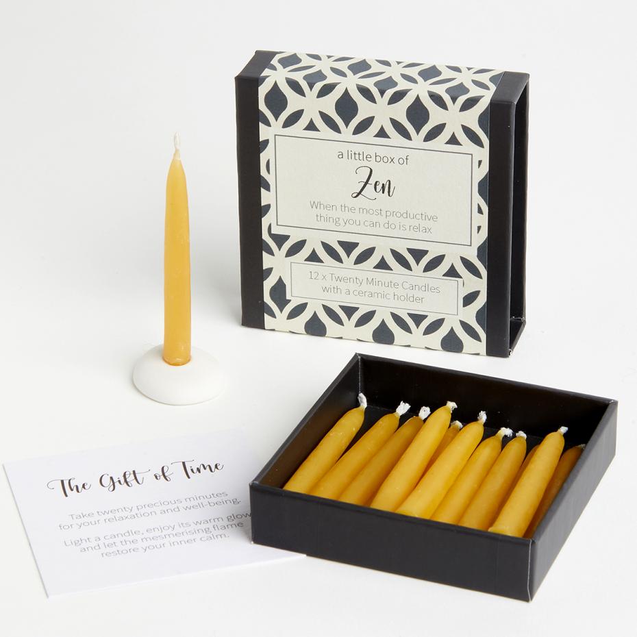 12 candles and a holder in each box