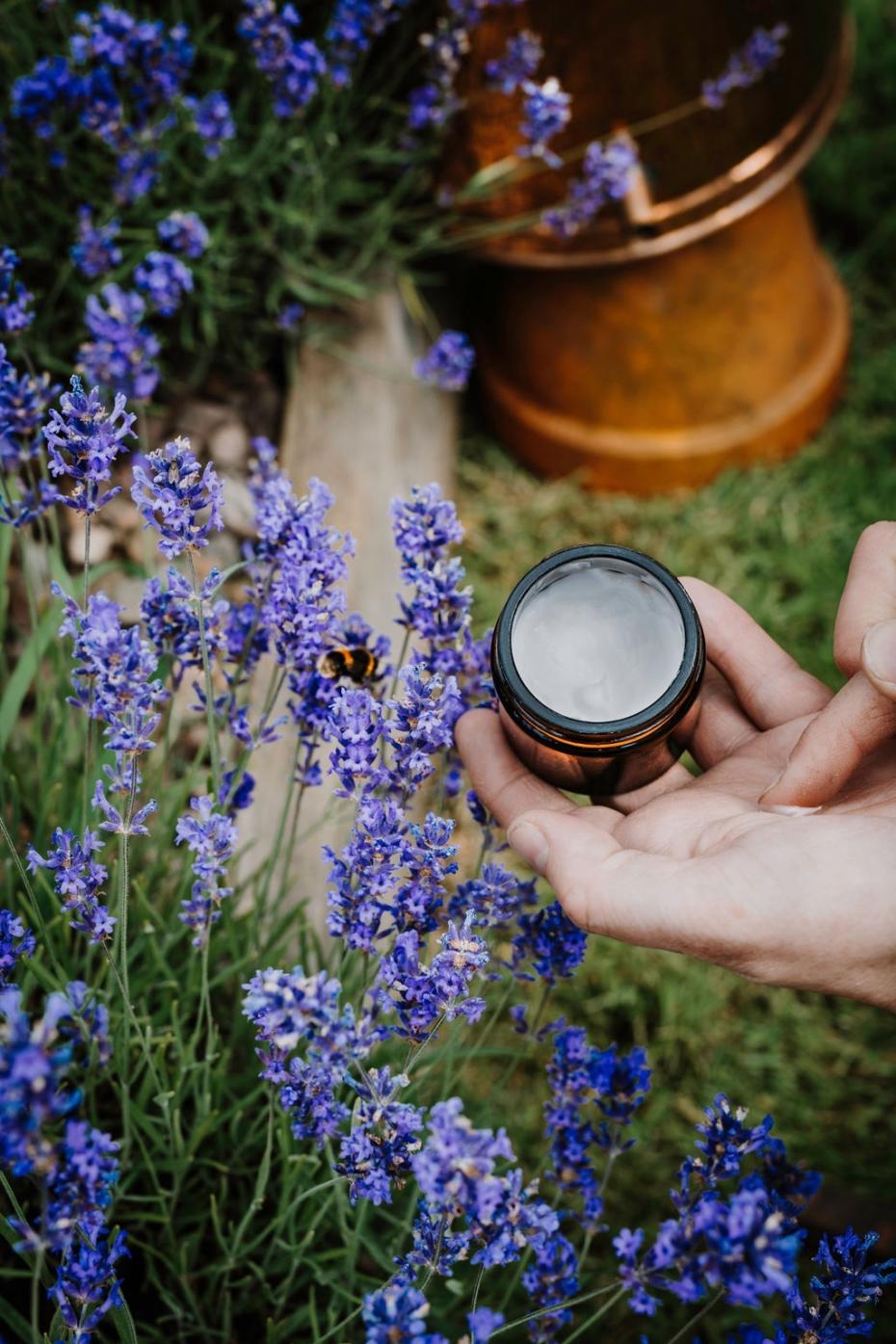 Lothian Lavender Hand Cream in the field with our still in the background